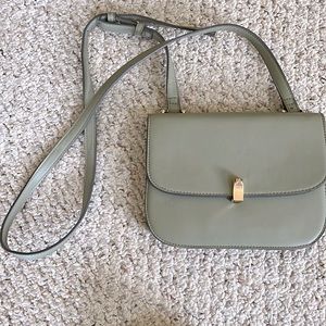 Sage green small purse. Five individual pockets on inside. Very lightly used.